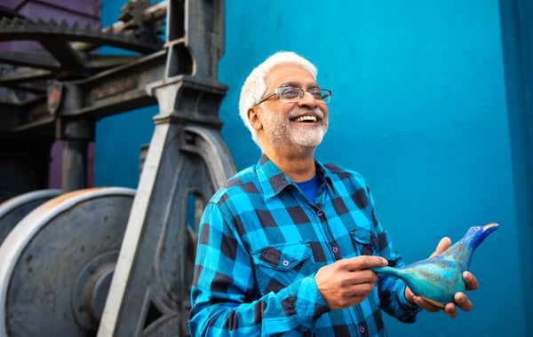 Man holding clay bird
